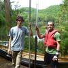 Paul Smith's College students Ben Eck and Alex Byrne with a sediment core they helped to collect from Lost Pond in June, 2012.  A radiocarbon date from the base of the core suggests that these sediments represent the last 2000 years of Adirondack precipitation history.