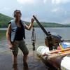 Queen's University grad student Cassie Cummings with a sediment corer on Wolf Lake in June, 2012.